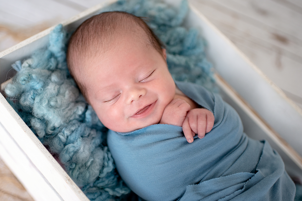 smiling little sleeping baby - professional newborn photography by Kelly McCambley