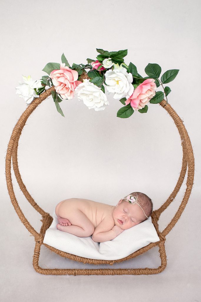 newborn in a special bed prop - professional newborn photography by Kelly McCambley
