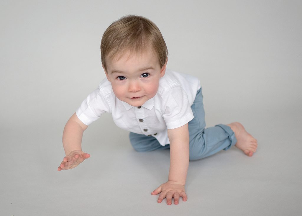 Little toddler on all fours crawling towards the camera